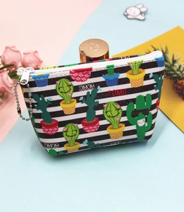 Close-up of cactus pattern canvas coin purse with zipper and stripe design