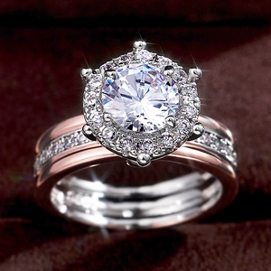 Elegant two-tone engagement ring with round zircon halo and rose gold band details