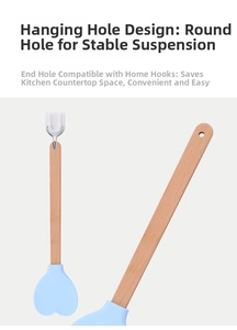 Detail showing silicone heart spatula with beechwood handle hanging by a storage hook