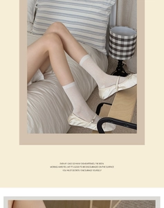 Vertical ribbed off-white crew socks styled with Mary Jane shoes in a cozy home setting