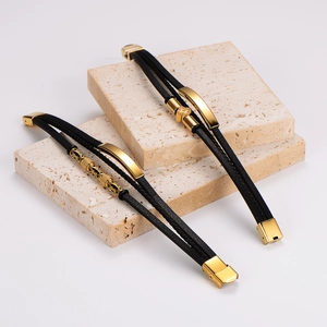Men's double-layered black leather bracelet with gold stainless steel clasp on stone