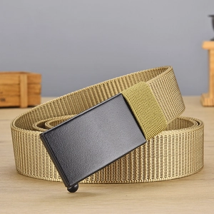 Detail of khaki nylon belt strap with black metal buckle on a wooden tabletop