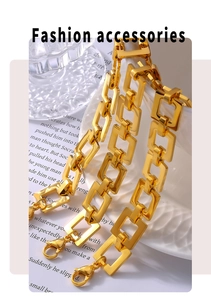 Detail of gold geometric square link bracelet featuring a secure lobster clasp closure