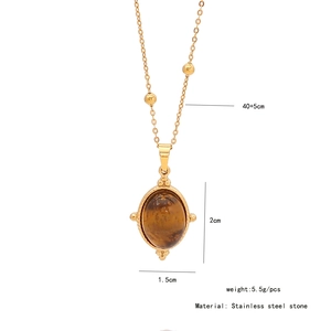 Macro view of gold stainless steel necklace with brown tiger eye stone and dimensions
