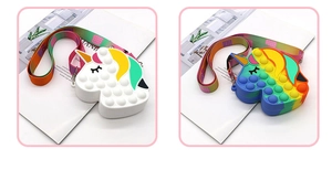 Close-up of silicone unicorn pop-it shoulder bags with adjustable rainbow straps
