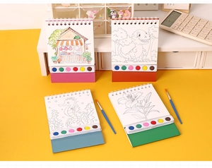 Detail of portable watercolor book with 6-color paint palette and brushes for DIY painting