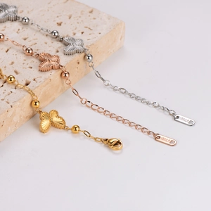Bracelet papillon 18KGP en trois couleurs : or, or rose et argent poli brillant
