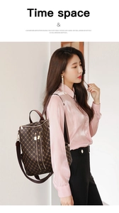 Detail of monogram backpack featuring gold-tone hardware and multiple zipper pockets