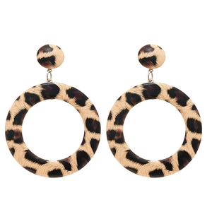 Exaggerated leopard print hoop earrings with round studs in a retro geometric design