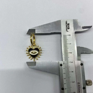 Macro view of evil eye heart pendant size measurement with a vernier caliper