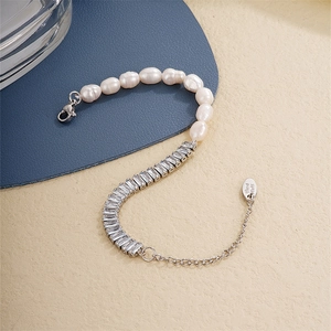 Elegant pearl and zircon bracelet featuring a silver-plated chain and handmade tag charm