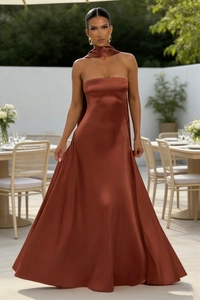 Detailed view of backless satin maxi dress in rust red with matching neck scarf accessory