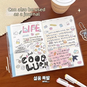 Detailed view of transparent PVC binder notebook with grid paper and cute cat stickers