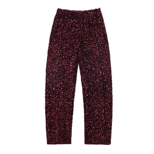 Sparkling burgundy sequin high-waisted trousers with elastic waist on white background