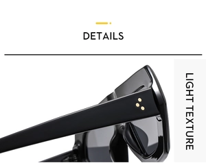 Detail view of bold black sunglasses with triple gold rivet decorations on the thick temple