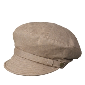 Casquette plate en lin marron avec bouton en métal vintage et texture respirante