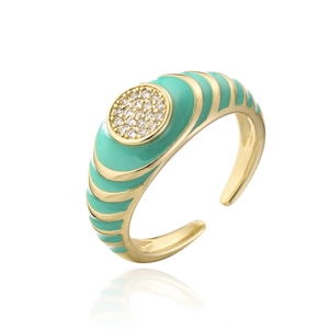 Detail of mint green enamel ring with 18K gold plating and white zircon pave setting