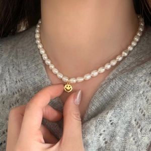 French vintage freshwater pearl necklace with a gold smiley face heart pendant charm