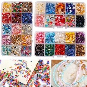 Assorted colorful glass seed beads and bugle beads in storage kits for DIY jewelry making