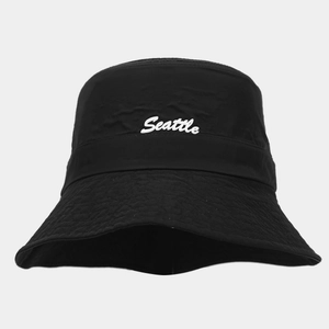Close-up of black breathable nylon bucket hat featuring white Seattle embroidery detail