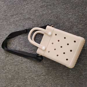Fashionable beige EVA cartoon shoulder bag with perforated design and black strap