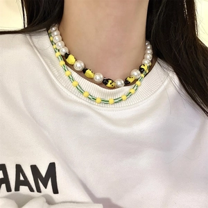 Double-layered beaded necklace with yellow bee charms and white faux pearls for women