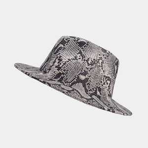 Close-up of elegant snake print wool fedora hat with detailed fabric texture and ivory base