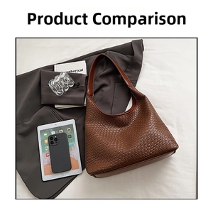 Brown woven leather hobo bag with iPad and lifestyle accessories on white fabric