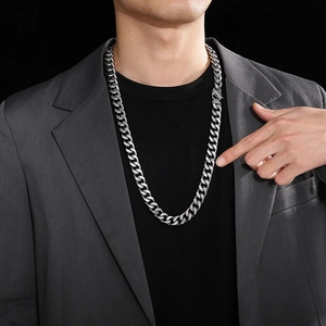 Silver stainless steel 14mm Cuban link chain necklace on male model with grey suit