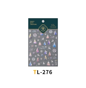 Detailed close-up of Christmas nail stickers featuring holographic reindeer and snowflakes