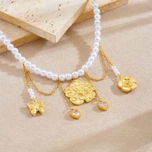 Vintage pearl necklace with gold plated stainless steel floral and butterfly pendants