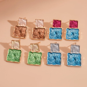 Set of four pairs of geometric square earrings with textured enamel inlay and gold plating