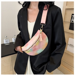 Close-up of rainbow gradient leather fanny pack with stylish pink wide strap