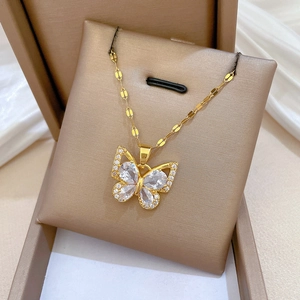 Detail of a butterfly pendant with water-drop zircons in a brown jewelry gift box