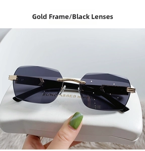 Detail of rimless rectangle sunglasses with gold temples and white leather case