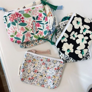 Floral cotton coin pouches and mini storage bags with zipper closure in various patterns