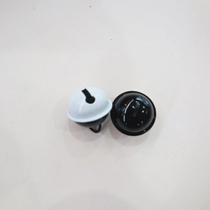 Close-up of 22mm black and white bicolor painted metal bells for DIY crafts and keychains