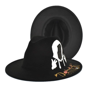 Black fedora hats featuring white hooded figure print and golden Demon script on the brim