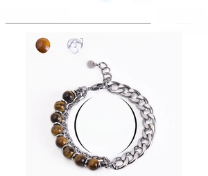 Detail of 8mm tiger eye stone beads combined with heavy silver metal chain and lobster clasp