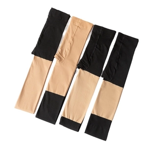 Black and nude patchwork over-the-knee sheer pantyhose tights for women on white background