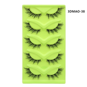 Detailed top view of five pairs of 3D faux mink lashes on a green tray, model 3DMAO-38