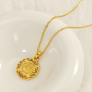 Elegant gold titanium necklace with letter C pendant and embossed vintage round design