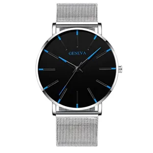 Detail of minimalist black watch dial with blue markers and silver mesh strap
