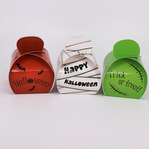 Three Halloween gift candy boxes in orange white and green with bat and mummy designs
