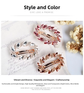 Detailed close-up of three crystal-encrusted oval hair clips in pink and amber