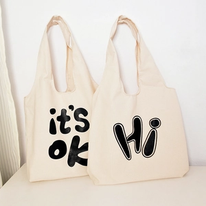 Casual large capacity canvas tote bag for women, simple aesthetic daily shopping bag.