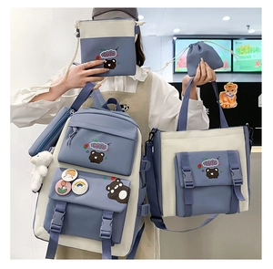 Detailed view of the 4-piece nylon school bag set featuring cute bear and plush charm