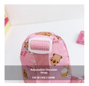 Close-up of pink Capybara kids bag showing the adjustable shoulder strap and plastic buckle