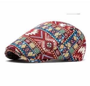 Close-up of ethnic geometric jacquard fabric on a burgundy vintage newsboy cap