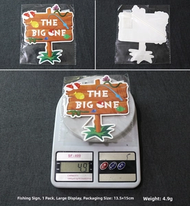 Detailed view of The Big One fishing theme cake topper with printed buoy and fish graphics